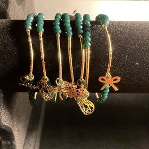 Gold plated 7day bracelets with assorted charms